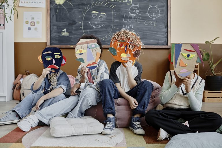Kids Holding Handmade Masks in Class
