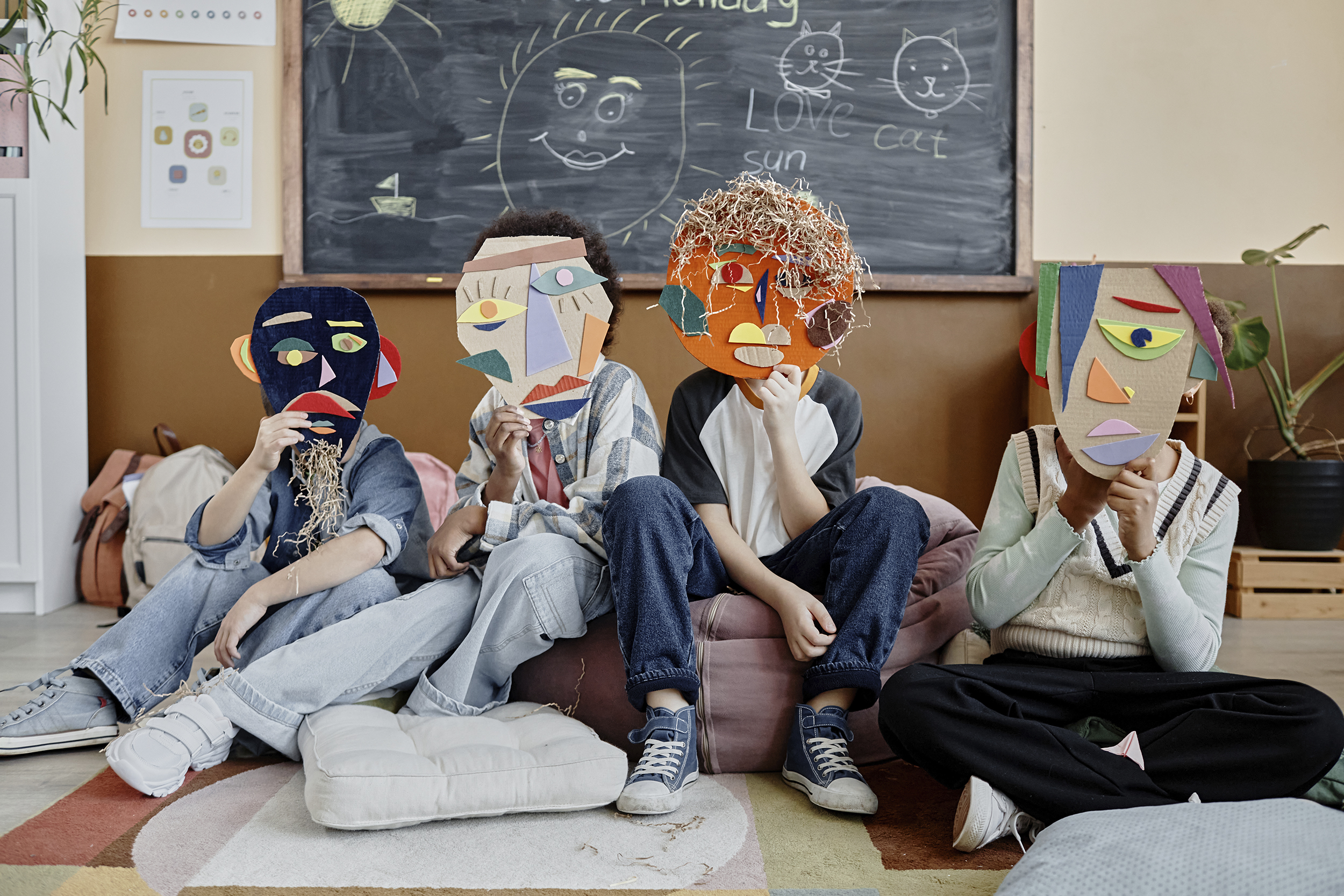 Kids Holding Handmade Masks in Class