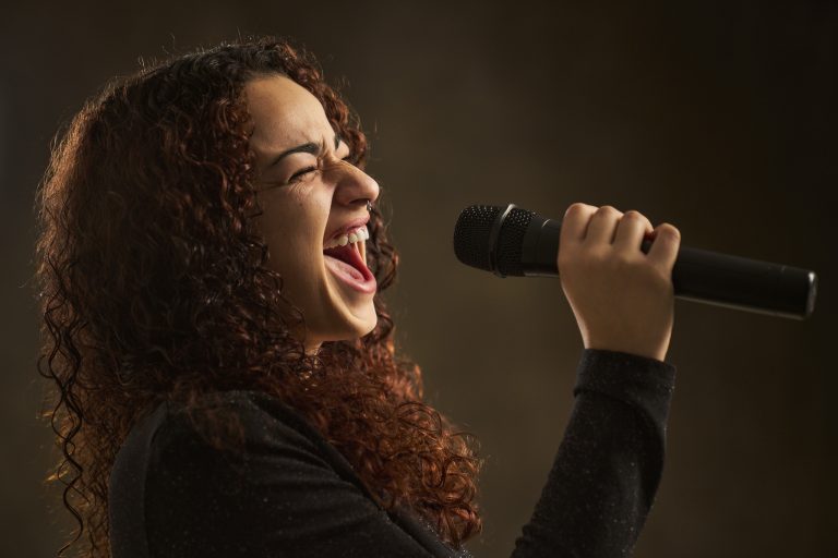 Professional female singer with microphone